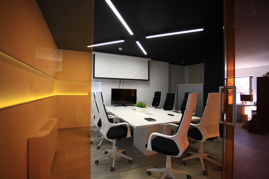 The orange meeting room in the new offices